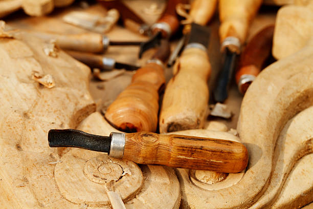 istock carving tool closeup on wooden background 505331486