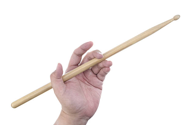 istock Isolated male left hand holding drum stick in traditional positi 505331904