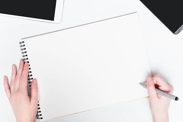istock Woman hand with pen on a white background. Mockup 505331912