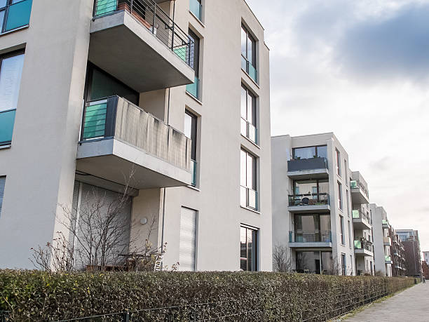 istock Apartment Buildings Surrounded by Hedge 505332310