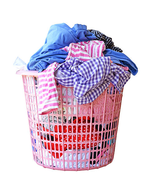 istock Clothes in a laundry basket isolated (clipping path) 505332684