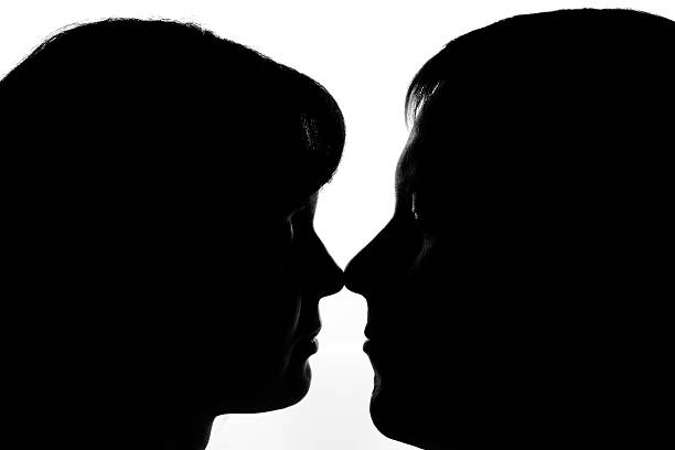 istock Black and white silhouettes of couples in love 505334238