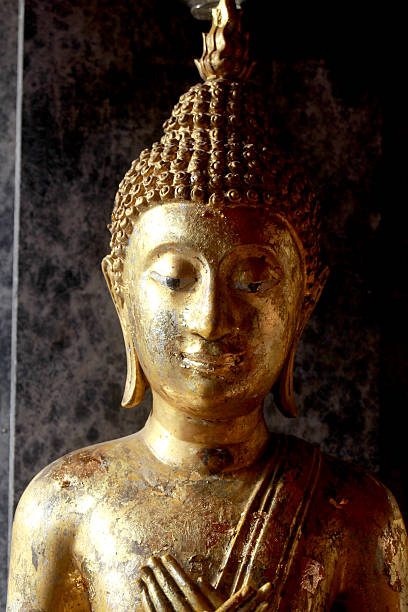 istock golden buddha in the dark 505334728