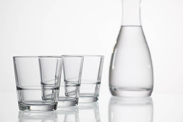 istock Glasses of water on the glass table 505335122