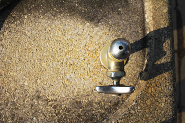 It is a water faucet in the park.