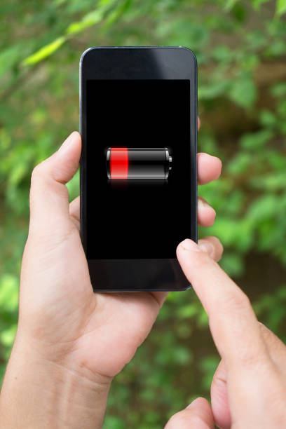 istock Battery Low Concept with Holding smartphone 505338464