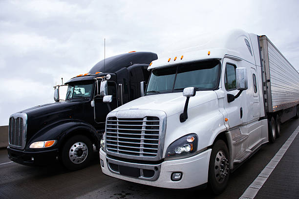 istock Two contrast modern semi truck different models black and white 505339736