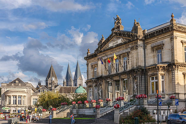 Spa, Belgium Spa, Belgium - September 19, 2014: People in the old town of Spa, in front of the building of the historic spa. The city of Spa is located in a valley of the Ardennes mountains, rich of rivers and springs, and is famous for its mineral waters and for the spa. spa belgium stock pictures, royalty-free photos & images