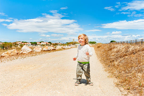 istock Little boy playing outdoors 505340908
