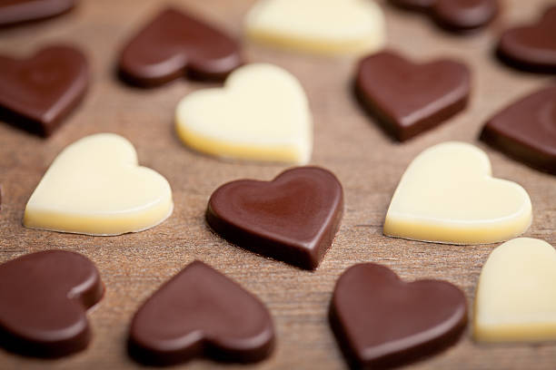 istock Chocolate hearts on old wooden table 505341092