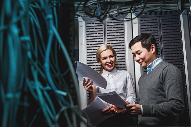 istock Young engineers businessmen in server room 505342748