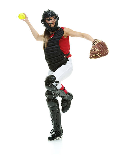 Softball player throwing a ball Softball player throwing a ballhttp://www.twodozendesign.info/i/1.png Chest Protector stock pictures, royalty-free photos & images