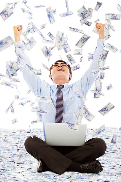 istock business man making a successful pose with money rain background 505365057