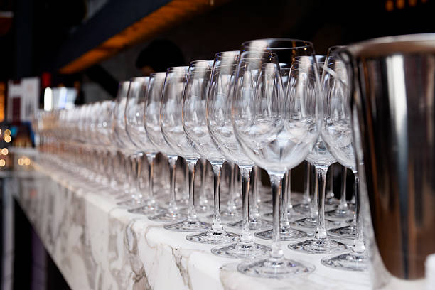 istock Rows of wineglasses in bar 505365363