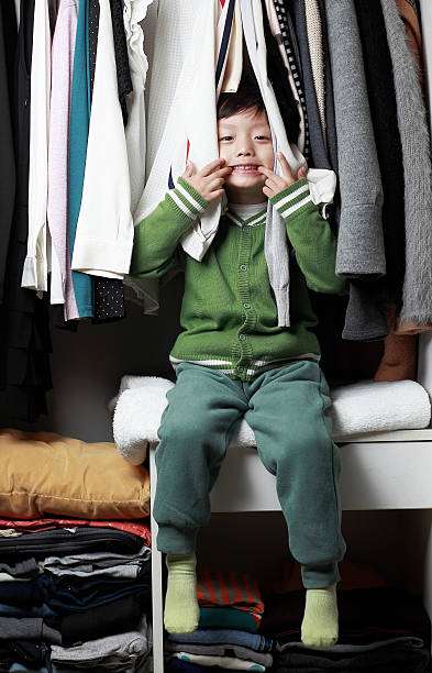 istock Child playing in the closet 505365954