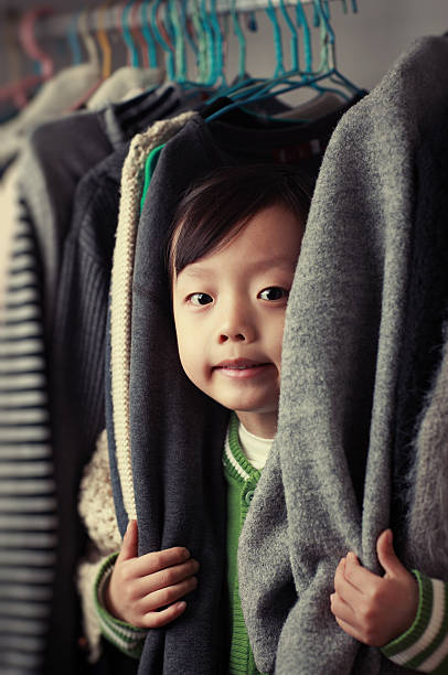 istock Child playing in the closet 505365970