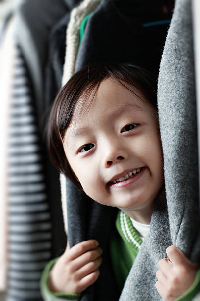 istock Child playing in the closet 505365992