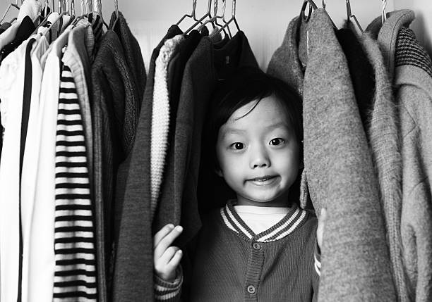 istock Child playing in the closet 505366216