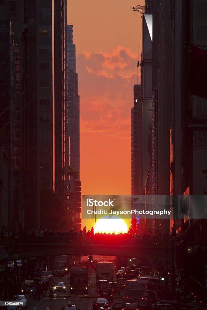 Manhattanhenge Manhattanhenge is a circumstance which occurs twice a year, during which the setting sun aligns with the east–west streets of the main street grid in the borough of Manhattan in New York City.   New York City Stock Photo