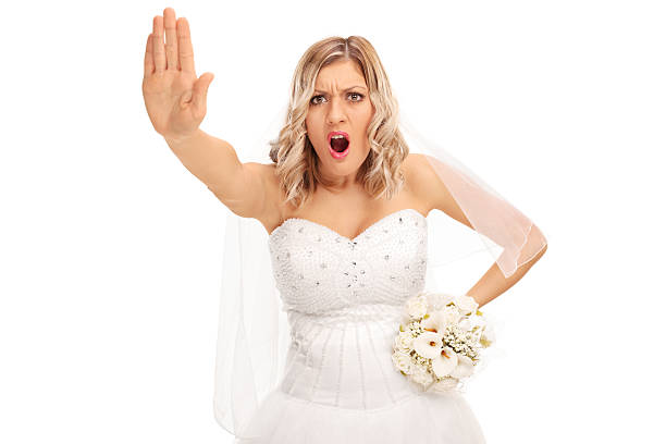 istock Displeased bride making a stop hand gesture 505370398