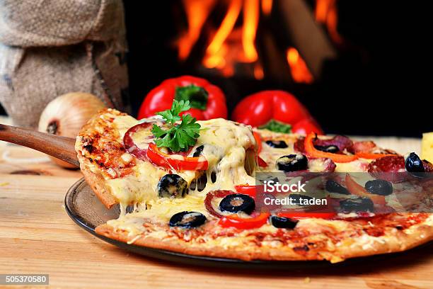 Tasty Pizza Stock Photo - Download Image Now - Pizza, Pizzeria, Flame