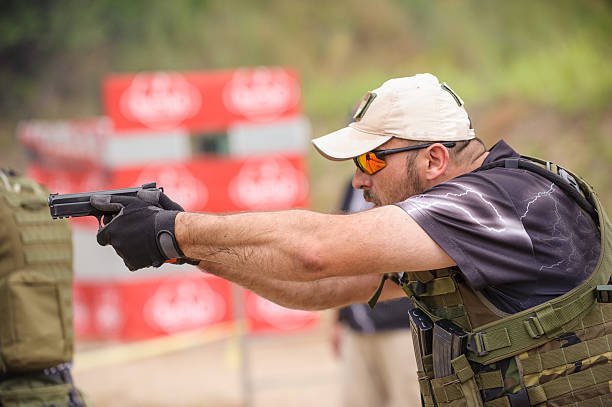 Shooting and Weapons Training Shooting and Weapons Training. Outdoor Shooting Range pistol shooting stock pictures, royalty-free photos & images