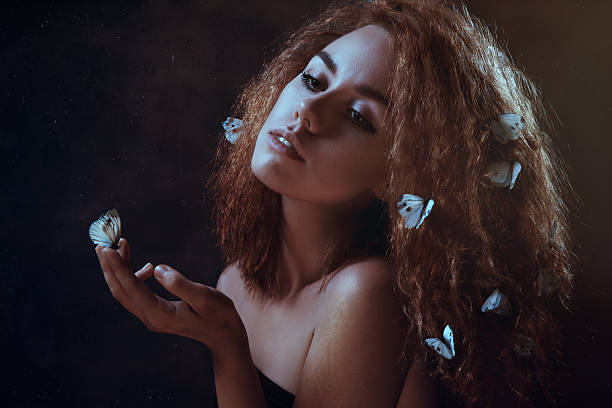 istock Woman and butterflies 505370935