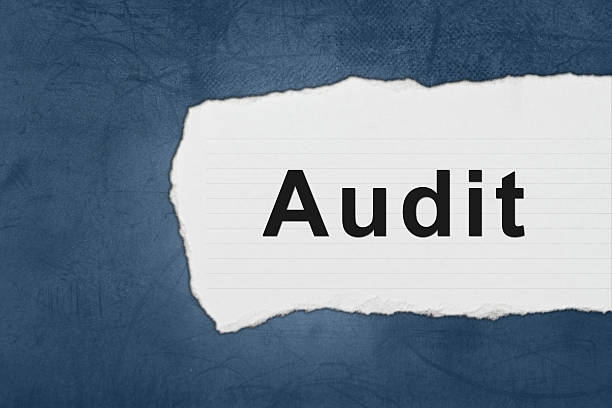 audit with white paper tears stock photo