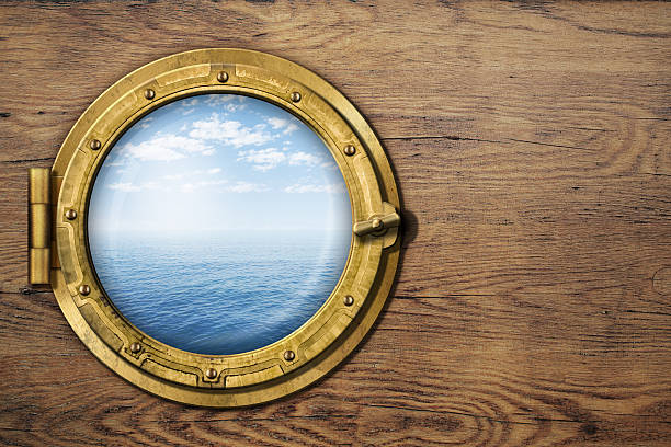 ship or boat porthole on wooden wall ship porthole on wooden wall porthole stock pictures, royalty-free photos & images