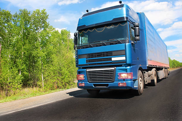 istock Trailer on country road 505372561