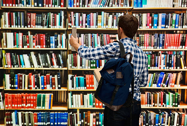 istock Rear view of student in library 505372680