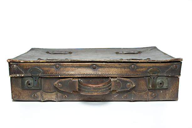 istock Antique leather luggage on isolated white 505373646