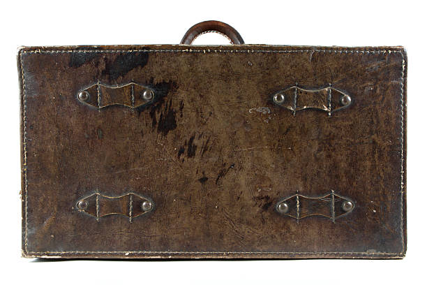 istock Antique leather luggage on isolated white 505374020