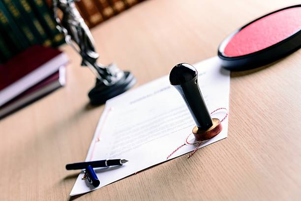 istock Stamp of notary public on signed document 505376904