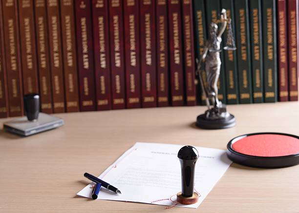 istock Signed by a notary document with his stamp and pen. 505377030