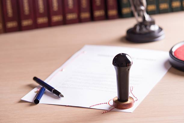 istock Stamp of the notary on testament and last will 505377108