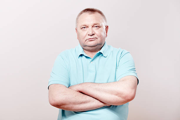 istock Senior with crossed arms 505377400
