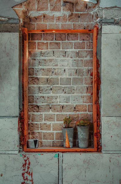 istock Window sealed with red bricks in an abandoned building 505377940