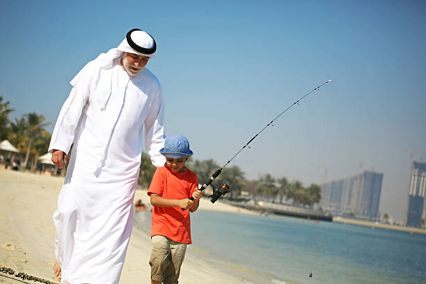 istock Two generations fishing together 505378202