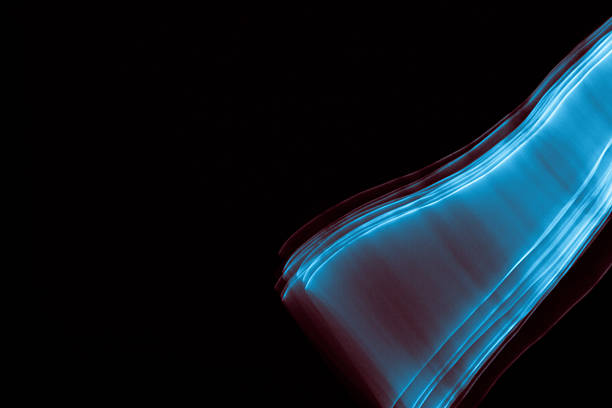 Light painted glowing abstract blue and red curved lines on a black background