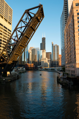 A color image of the Kinzie street bridge and downtown Chicago with the last few minutes of golden sun before sunset.