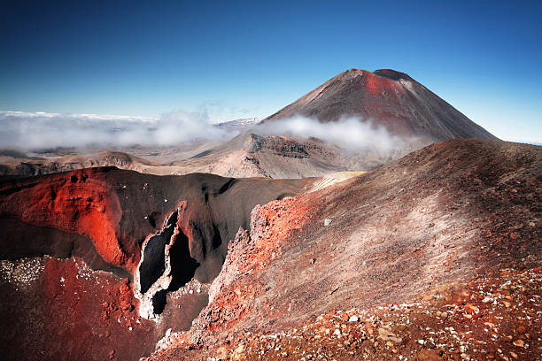 Mount Ngauruhoe (a.k.a. Mt. Doom), North Island, New Zealand Mount Ngauruhoe (volcano) played Mount Doom in "Lords of the Rings" trilogy. Seen from Tongariro Alpine Crossing, which is said to be the most popular one day hike in New Zealand. tongariro national park photos stock pictures, royalty-free photos & images
