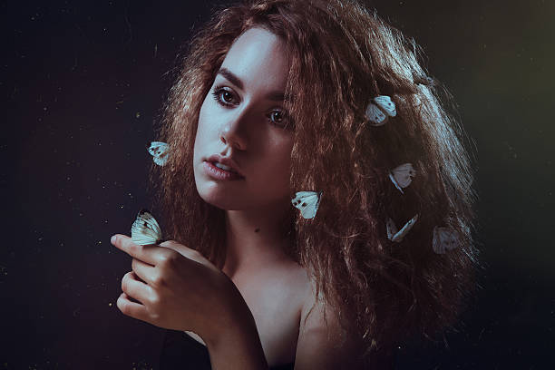 istock Woman and butterflies 505397881