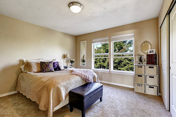 istock Simple bedroom interior with bed and ottoman 505398551