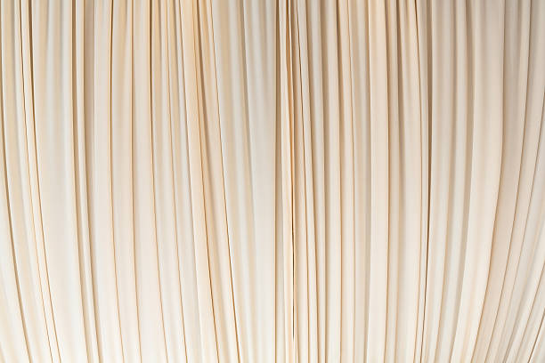 istock Cloth curtain in pastel yellow color 505399876