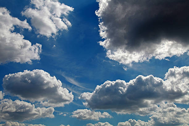 istock White and grey fluffy clouds in the dramatic blue sky 505400325