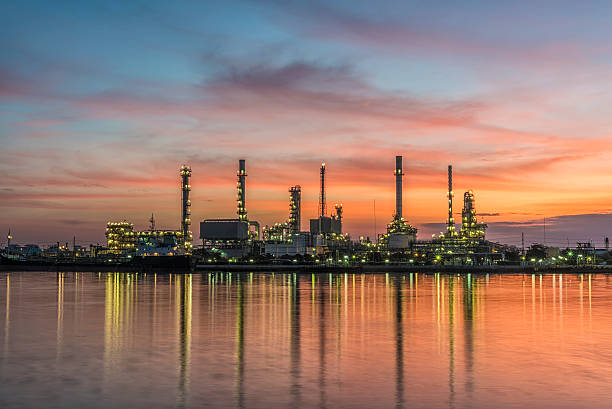 Oil refinery with beautiful sunrise stock photo