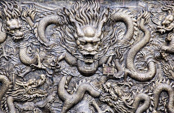 istock Ancient bronze dragons carving in the ancient Dragon King Temple 505403636