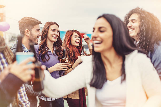 istock Party people smiling outdoors 505403806