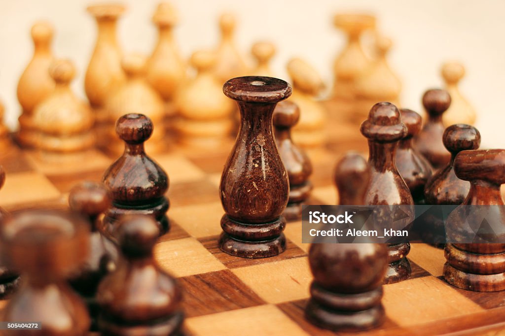 Wooden chess board with the king in focus A Beautiful wooden chess board with the king in focus  Achievement Stock Photo